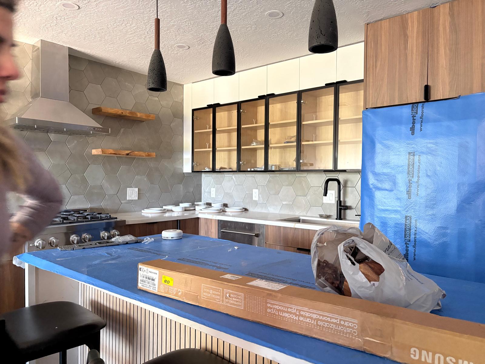 Kitchen mid-install with surfaces protected