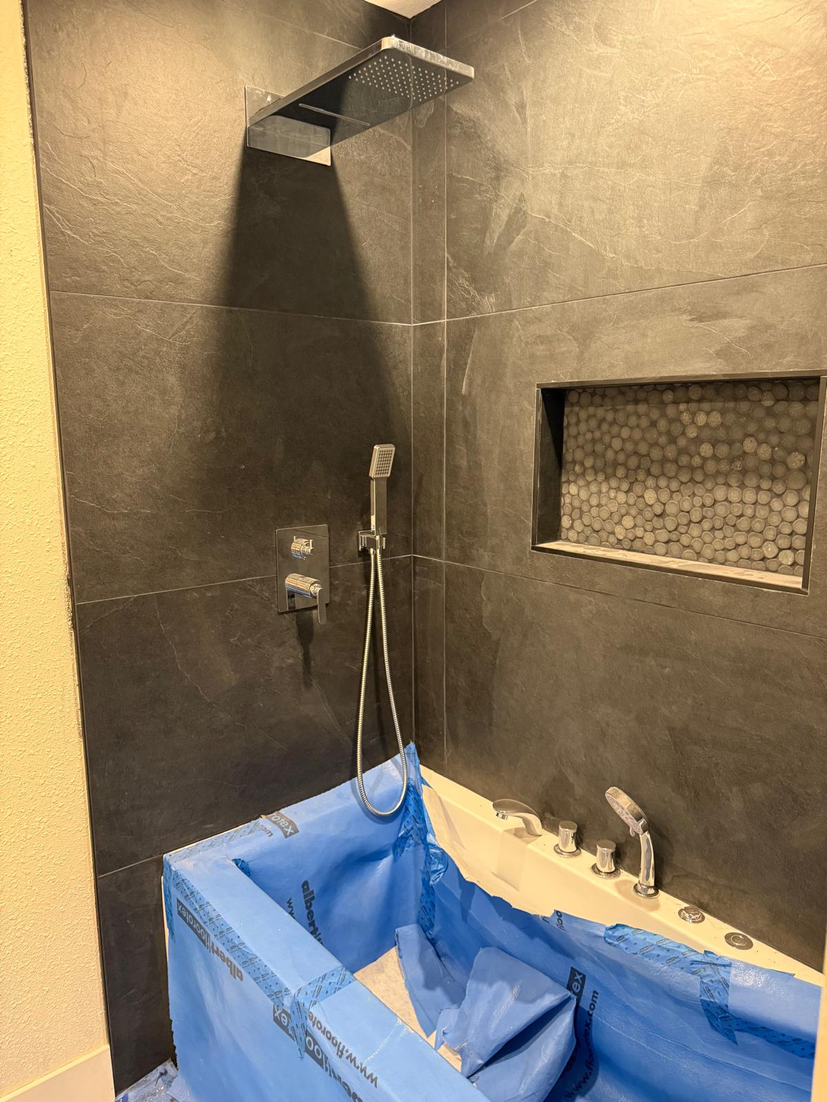 Slate shower install with the tub protected