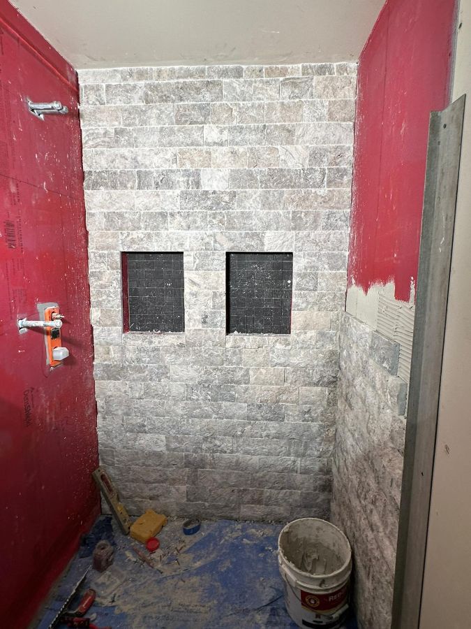 Stone shower wall going up